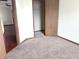 Bedroom featuring carpeting and closet that creates a cozy retreat for rest and relaxation at 607 Deer Trail Dr, Indianapolis, IN 46217