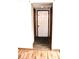 Entryway featuring a front door and a dark gray door mat with wood and tile flooring at 607 Deer Trail Dr, Indianapolis, IN 46217