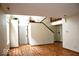 Inviting entryway with beautiful wood-look flooring, staircase and contemporary design at 607 Deer Trail Dr, Indianapolis, IN 46217