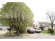 Two-story home with vinyl siding, dark shutters, and an attached two-car garage at 607 Deer Trail Dr, Indianapolis, IN 46217
