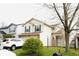 Two-story home with vinyl siding, dark shutters, and an attached two-car garage at 607 Deer Trail Dr, Indianapolis, IN 46217