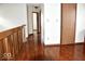 Hallway featuring hardwood floors and natural light at 607 Deer Trail Dr, Indianapolis, IN 46217