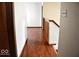 Hallway featuring hardwood floors and natural light at 607 Deer Trail Dr, Indianapolis, IN 46217