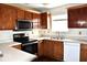 Updated kitchen featuring stainless steel appliances, stylish wooden cabinets, and functional countertops at 607 Deer Trail Dr, Indianapolis, IN 46217