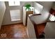 Top down staircase view with hardwood floors and natural light from a window at 607 Deer Trail Dr, Indianapolis, IN 46217