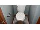 Toilet seat in a bathroom with grey walls and tile flooring at 607 Deer Trail Dr, Indianapolis, IN 46217