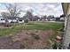 Spacious backyard enclosed by a chain link fence featuring a small wooden pergola at 609 E Columbus St, Martinsville, IN 46151