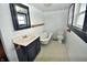 Well-lit bathroom with a classic clawfoot tub and vanity, perfect for relaxation at 609 E Columbus St, Martinsville, IN 46151