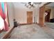 Spacious bedroom featuring neutral walls, carpet flooring, and a ceiling fan with light fixture at 609 E Columbus St, Martinsville, IN 46151