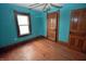 Inviting bedroom with hardwood floors and an abundance of natural light at 609 E Columbus St, Martinsville, IN 46151