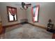 Cozy bedroom featuring hardwood floors and plush carpet, awaiting personal touches at 609 E Columbus St, Martinsville, IN 46151