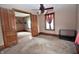 Bedroom features hardwood floors, plush carpet, and inviting entryway with wooden sliding doors at 609 E Columbus St, Martinsville, IN 46151
