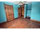 Bedroom boasts hardwood floors and ample closet space for optimal storage at 609 E Columbus St, Martinsville, IN 46151