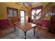 Traditional dining room featuring hardwood floors, table, built-in cabinet, and easy access to the staircase at 609 E Columbus St, Martinsville, IN 46151