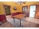 Classic dining room with hardwood floors, table, hutch, and adjacent rooms, perfect for entertaining and Gathering meals at 609 E Columbus St, Martinsville, IN 46151