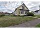 Captivating home with a well-manicured lawn, and inviting curb appeal at 609 E Columbus St, Martinsville, IN 46151