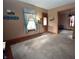 Inviting living room with hardwood floors, neutral carpet, and a welcoming ambiance at 609 E Columbus St, Martinsville, IN 46151