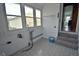 Cozy sunroom with tile floors, multiple windows, and a connection to the interior, offering a versatile space at 609 E Columbus St, Martinsville, IN 46151
