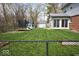 Fenced-in backyard features mature trees, a sunroom and a playground at 6133 Buttonwood Dr, Noblesville, IN 46062