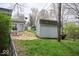 Backyard with grass includes an outbuilding and access to the sunroom at 6133 Buttonwood Dr, Noblesville, IN 46062