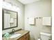 Bathroom features a granite countertop and a well-lit mirror at 6133 Buttonwood Dr, Noblesville, IN 46062