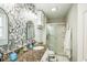 Stylish bathroom with stone accent wall and glass-enclosed shower at 6133 Buttonwood Dr, Noblesville, IN 46062