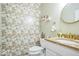 Charming powder room featuring unique bird-themed wallpaper, granite countertop, and gold accents at 6133 Buttonwood Dr, Noblesville, IN 46062