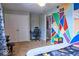 Bright bedroom featuring geometric accent wall, plush carpet, and spacious closet at 6133 Buttonwood Dr, Noblesville, IN 46062