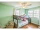 Cozy bedroom with bunk beds, hardwood floors, and charming decor at 6133 Buttonwood Dr, Noblesville, IN 46062