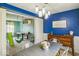 Dining room leading to playroom with air hockey table, climbing gym, and swing at 6133 Buttonwood Dr, Noblesville, IN 46062