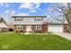 Charming two-story home featuring brick and siding, complemented by a well-maintained lawn and landscaping at 6133 Buttonwood Dr, Noblesville, IN 46062
