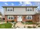 Inviting home with brick accents, charming shutters, and a well-manicured front garden at 6133 Buttonwood Dr, Noblesville, IN 46062