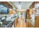 Well-lit kitchen featuring wood cabinets, granite countertops, and stainless steel appliances at 6133 Buttonwood Dr, Noblesville, IN 46062