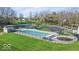 Community pool with ample seating, a splash pad and playground, perfect for Gathering fun at 6133 Buttonwood Dr, Noblesville, IN 46062