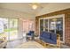 Relaxing sunroom with comfortable seating and sliding glass doors to patio at 6133 Buttonwood Dr, Noblesville, IN 46062