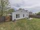 Wide angle view of the backyard with a patio and a privacy fence surrounding at 6212 Monteo Dr, Indianapolis, IN 46217