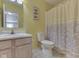 Bathroom with a vanity, toilet, and shower at 6212 Monteo Dr, Indianapolis, IN 46217