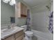 Bathroom featuring tub shower combo and vanity with sink at 6212 Monteo Dr, Indianapolis, IN 46217