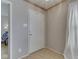 Clean entryway with wood trim, light walls and doorway to the living room at 6212 Monteo Dr, Indianapolis, IN 46217