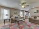 Bright living room featuring hardwood floors, a ceiling fan and large windows with great light at 6212 Monteo Dr, Indianapolis, IN 46217