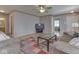 Spacious living room showcasing a comfortable seating arrangement and wood-look flooring at 6212 Monteo Dr, Indianapolis, IN 46217