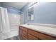 Well-lit bathroom with wooden vanity, tub and shower, and neutral colors for a clean aesthetic at 6259 Bishops Pond Ln, Indianapolis, IN 46268