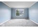 Bright, carpeted bedroom with large window at 6259 Bishops Pond Ln, Indianapolis, IN 46268