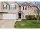 Charming home with an attached two-car garage, bay window, and a well manicured lawn at 6259 Bishops Pond Ln, Indianapolis, IN 46268