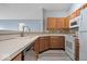 Modern kitchen equipped with stainless steel dishwasher and white appliances at 6259 Bishops Pond Ln, Indianapolis, IN 46268