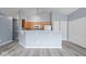 Open kitchen featuring tile backsplash and breakfast bar at 6259 Bishops Pond Ln, Indianapolis, IN 46268
