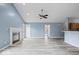 Open-concept living room with fireplace connects to the kitchen at 6259 Bishops Pond Ln, Indianapolis, IN 46268
