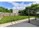 Lush backyard with a pergola-covered patio, a privacy fence, and a view of the home's exterior at 6479 Enclave Blvd, Greenwood, IN 46143