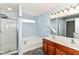 Bright bathroom featuring a double sink vanity, soaking tub, and a separate shower at 6479 Enclave Blvd, Greenwood, IN 46143