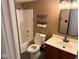 Bathroom with modern black accents, tub/shower and dark wood vanity at 6479 Enclave Blvd, Greenwood, IN 46143